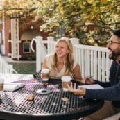 Students talking and laughing around a picnic table
