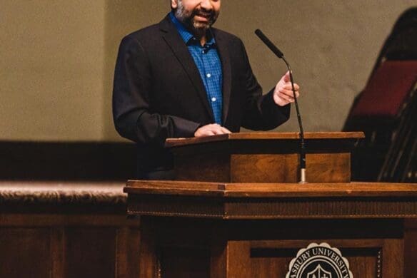 Dr. Praveen Sethupathy speaking in Hughes Auditorium
