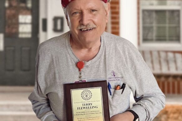 Terry Flewelling holding an award