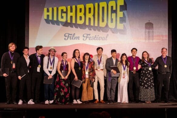 Group of award winners standing onstage at Highbridge Film Festival Cast and crew for Asbury University's Christian theatre program.