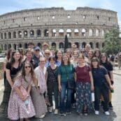Group of students with Coliseum in the background