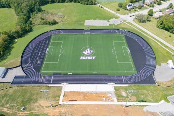 aerial view of construction near track and field