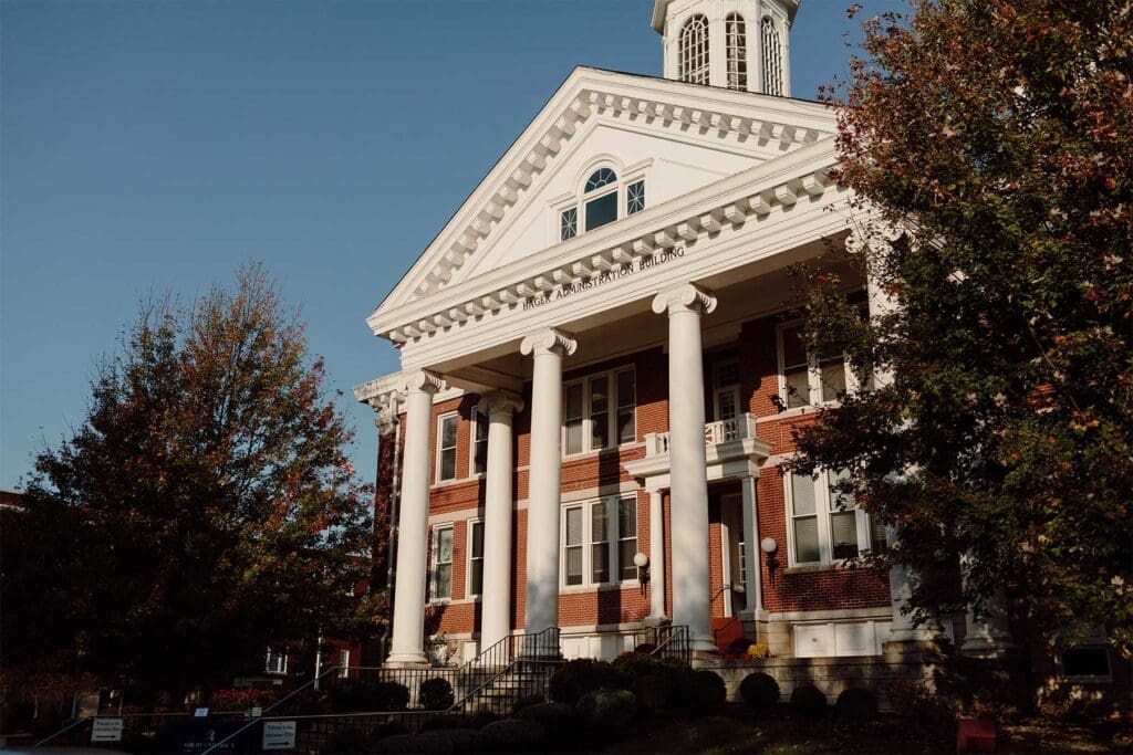 Front exterior of Hager Administration Building at Asbury University with Ionic columns and a gabled pediment.