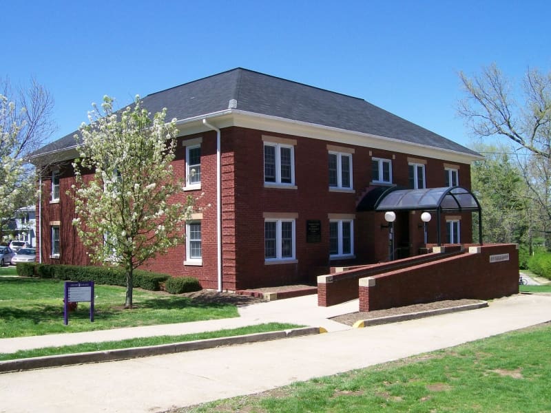 Entrance of the former Fletcher-Early Student Development Center at Asbury University, a two-story building with historical roots.