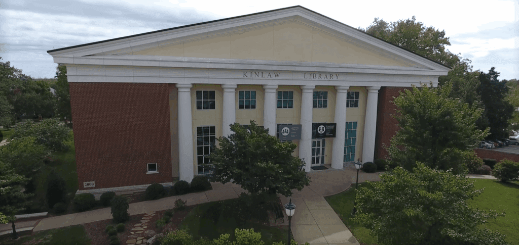Front entrance of Kinlaw Library at Asbury University with classical columns and a yellow pediment.