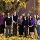 Asbury University School of Christian Studies Dean Brian Shelton with a group of students position on campus on a beautiful fall day.