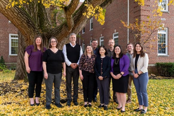 Asbury University School of Christian Studies Dean Brian Shelton with a group of students position on campus on a beautiful fall day.