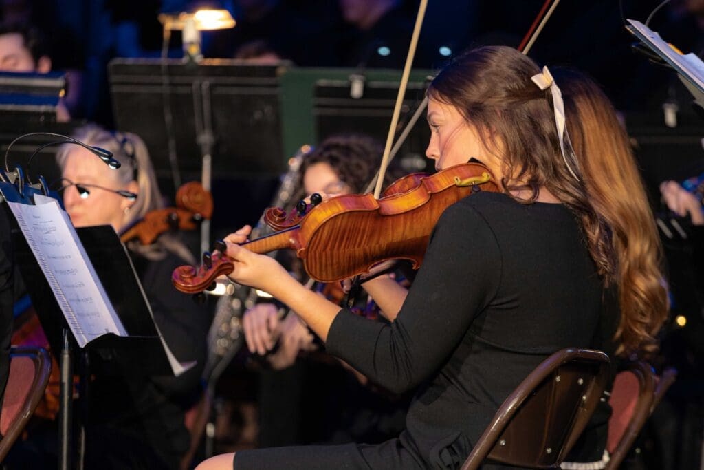 Female student playing violin at Songs of the Season at Asbury University.