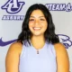 a female asbury athlete smiles