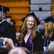 An Asbury University athlete smiles at Commencement
