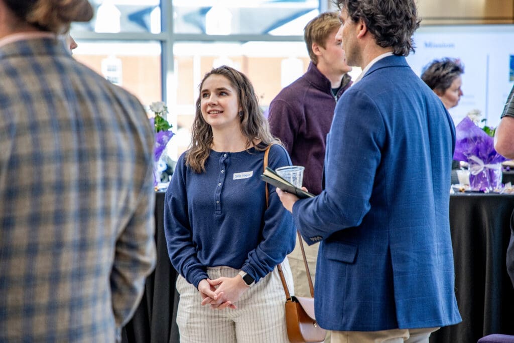 Asbury Business student smiles at Mentorship reception.