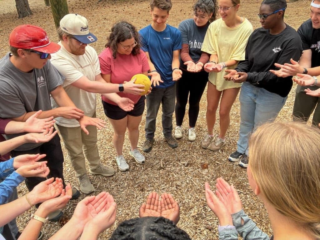 Group of Asbury students playing a game outside at the Set Apart retreat in Colorado.