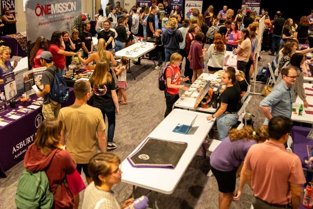 Asbury University Activities Fair with booths and students.