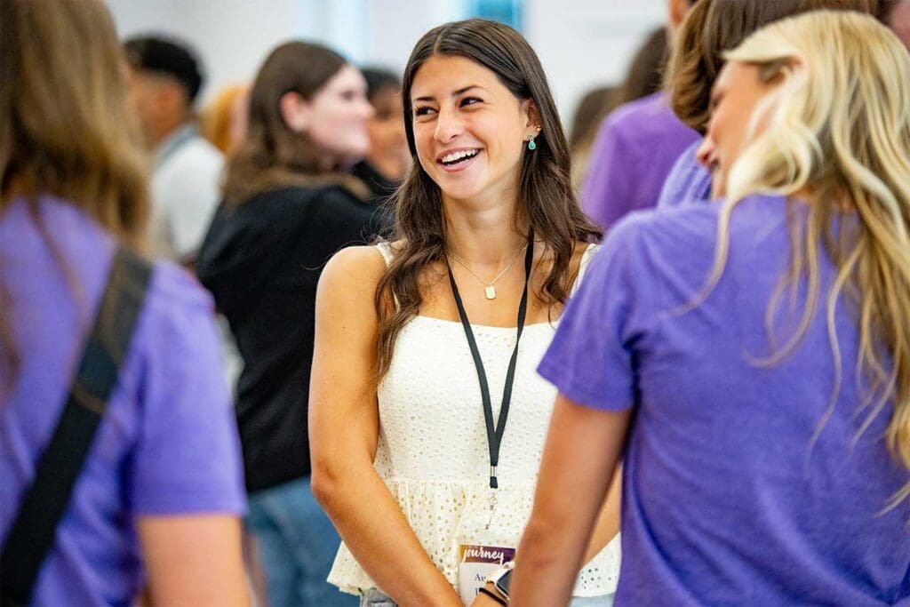 Asbury University Eagle Days new students laughing and talking with other students.