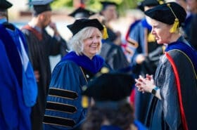 Asbury University professor Dr. Kim Okesson smiles during Academic Convocation