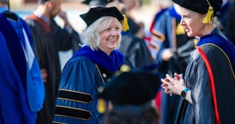 Asbury University professor Dr. Kim Okesson smiles during Academic Convocation