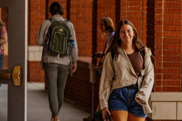 Asbury student walks under Archways