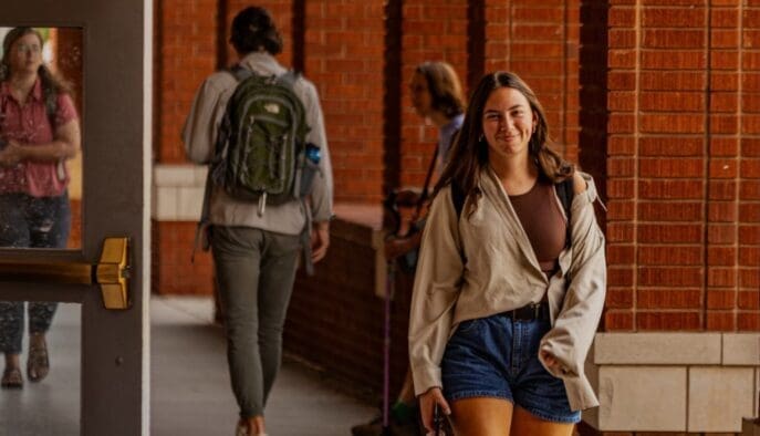 Asbury student walks under Archways