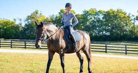 Asbury equine professor Cathrin Wilbanks rides a horse