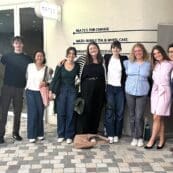 Asbury's Rob Lim stands with business internship students