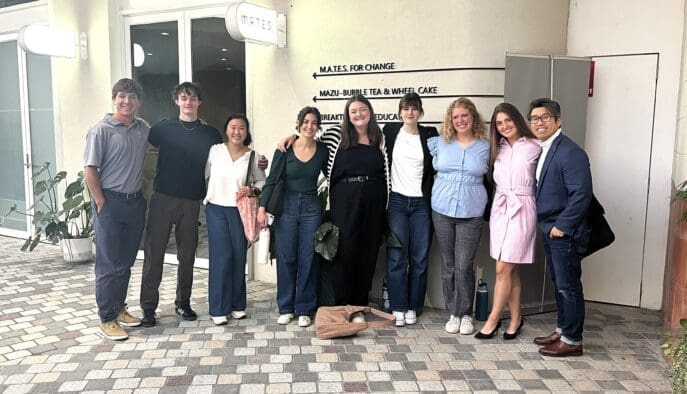 Asbury's Rob Lim stands with business internship students