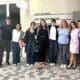 Asbury's Rob Lim stands with business internship students