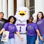 Asbury students cheer with Isaiah the Eagle
