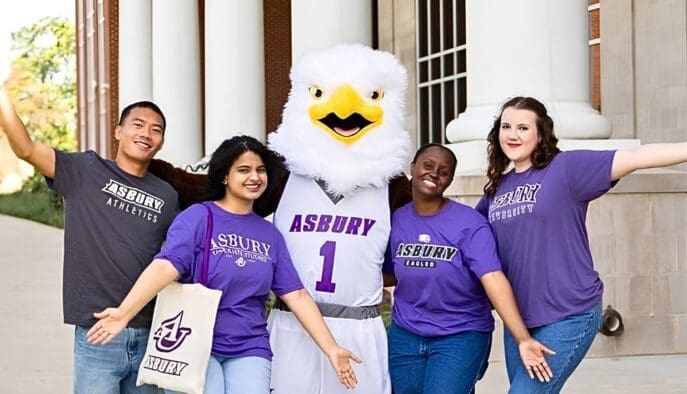 Asbury students cheer with Isaiah the Eagle