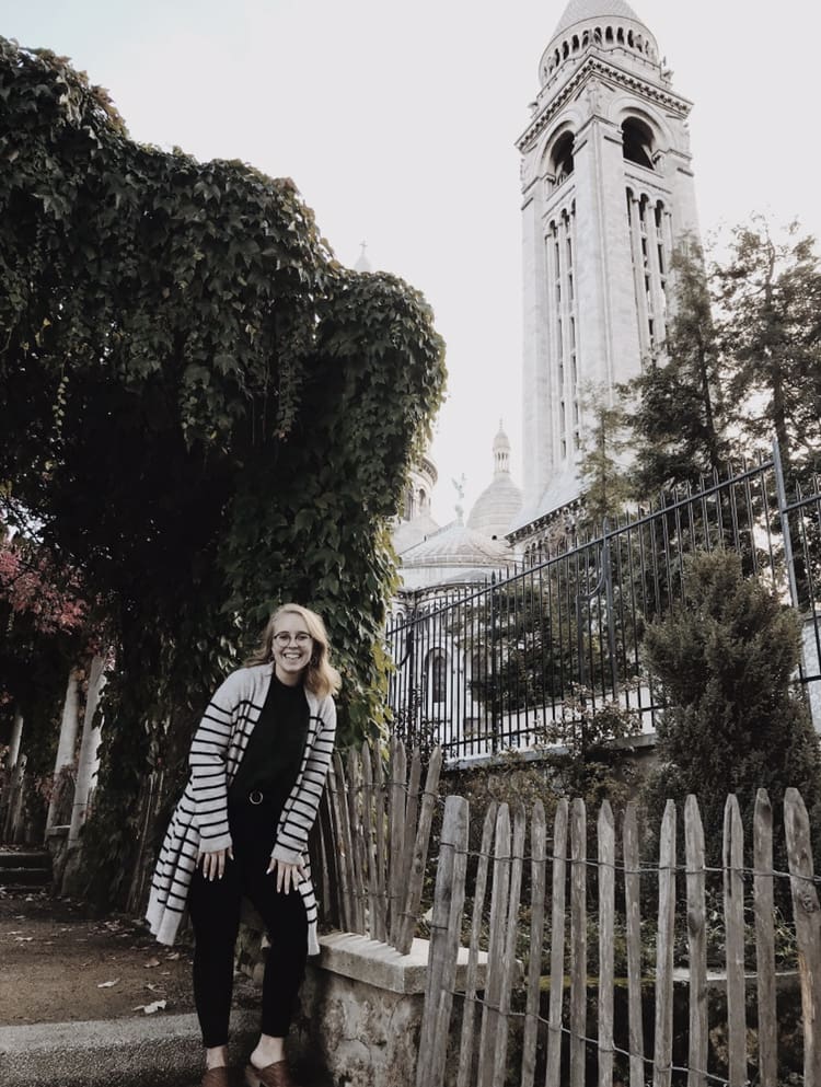 Student with large belltower in background