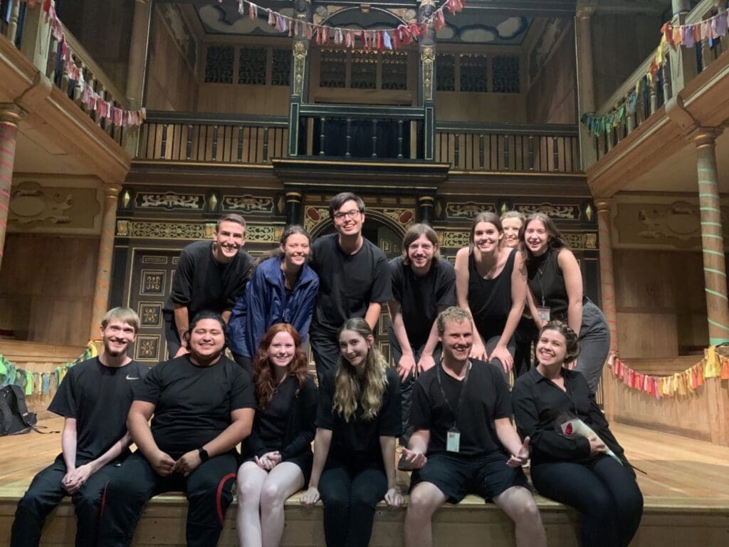 Students on stage at the Globe Theatre in London