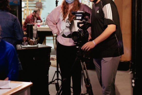 Students filming on a set