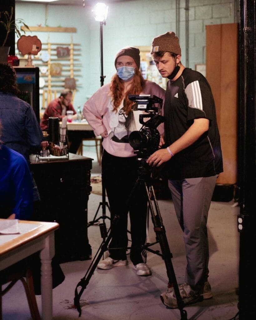 Students filming on a set