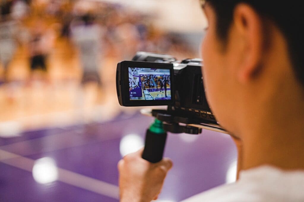 Media communications student with go-pro camera