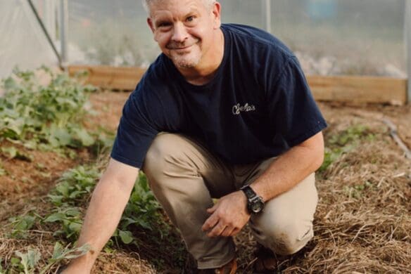 Dr. Marvin Ruffner working in a greenhouse