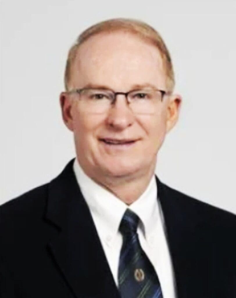 Headshot of Dr. Russell Raymond ’75