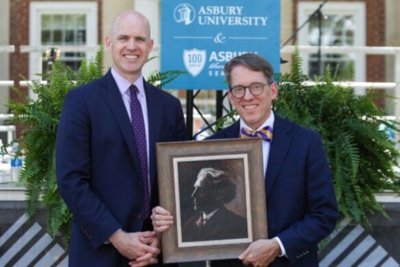 Dr. Kevin Brown and Dr. Timothy Tennent holding a portrait together