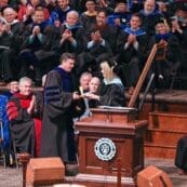 Dr. Strait receiving an award on stage