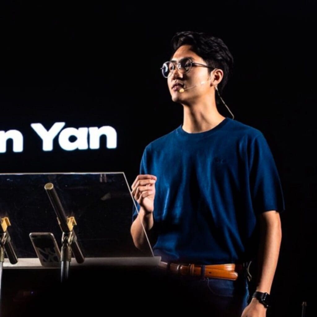 Canaan Yan speaking on stage