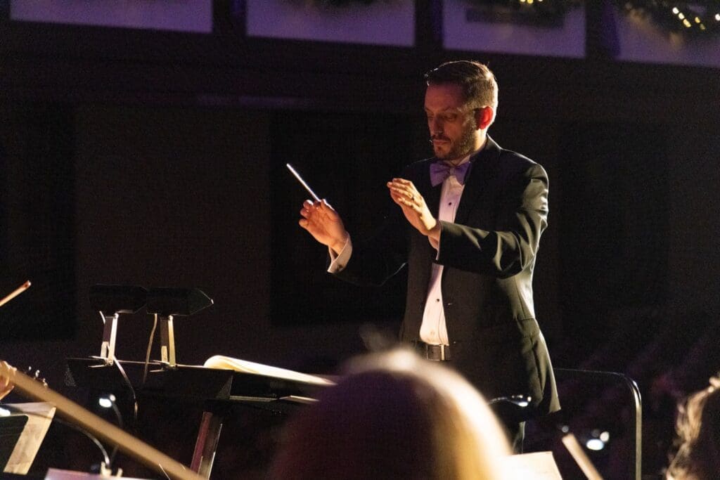 Dr. Nathan Miller conducting the orcheatra