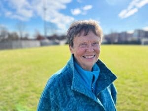 Carol Sue Ray '67 standing on a soccer field