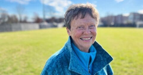 Carol Sue Ray '67 standing on a soccer field