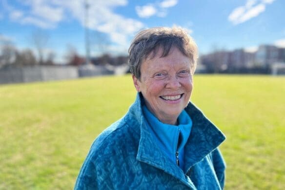 Carol Sue Ray '67 standing on a soccer field