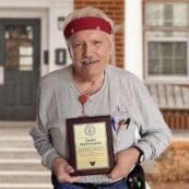Terry Flewelling holding an award