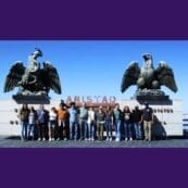 Group of students standing by the Amistad monument