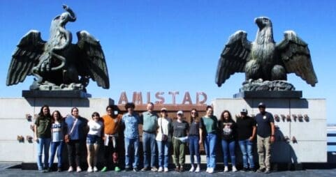 Group of students standing by the Amistad monument