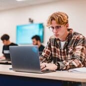 Business student working on a laptop