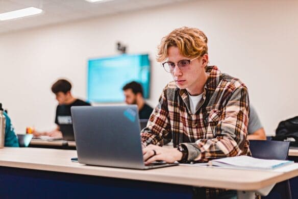 Business student working on a laptop