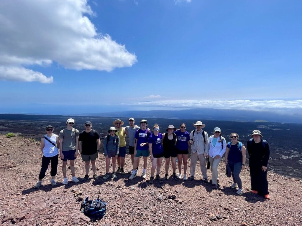 Group of students on top of a mountain