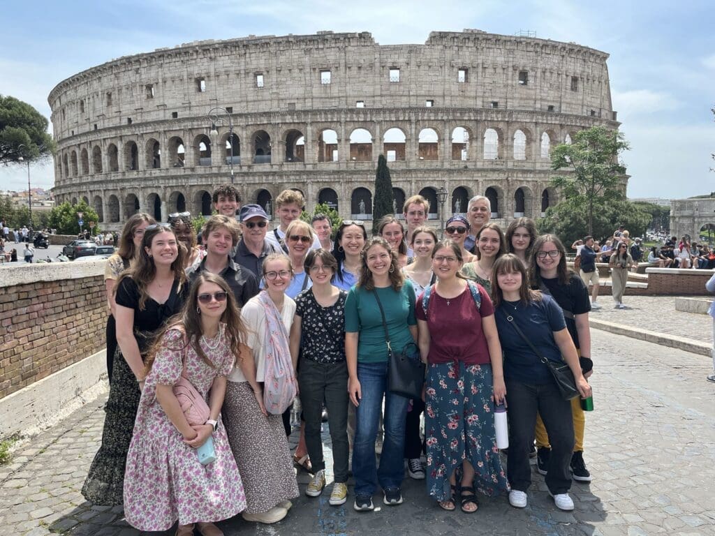 Group of students with Coliseum in the background