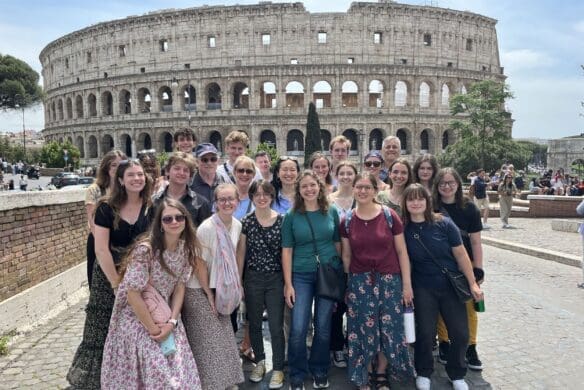 Group of students with Coliseum in the background